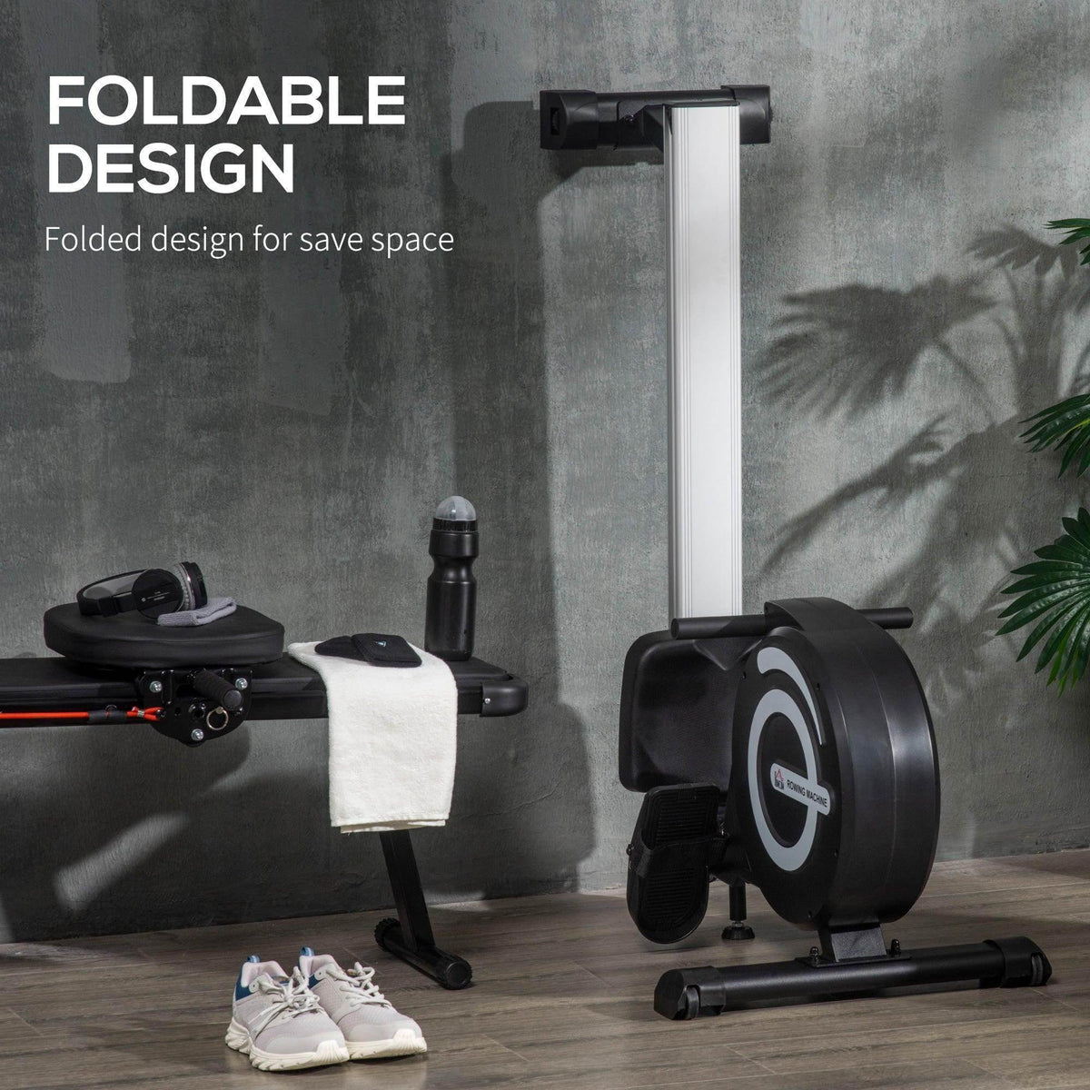 Foldable magnetic rowing machine standing upright with compact storage position