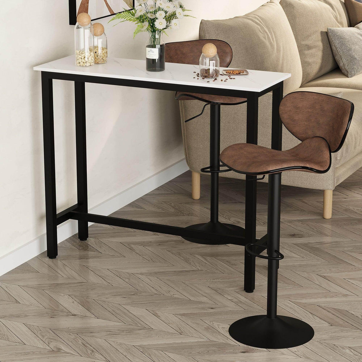 Marble-grain bar table with white top and black steel legs, with seating nearby
