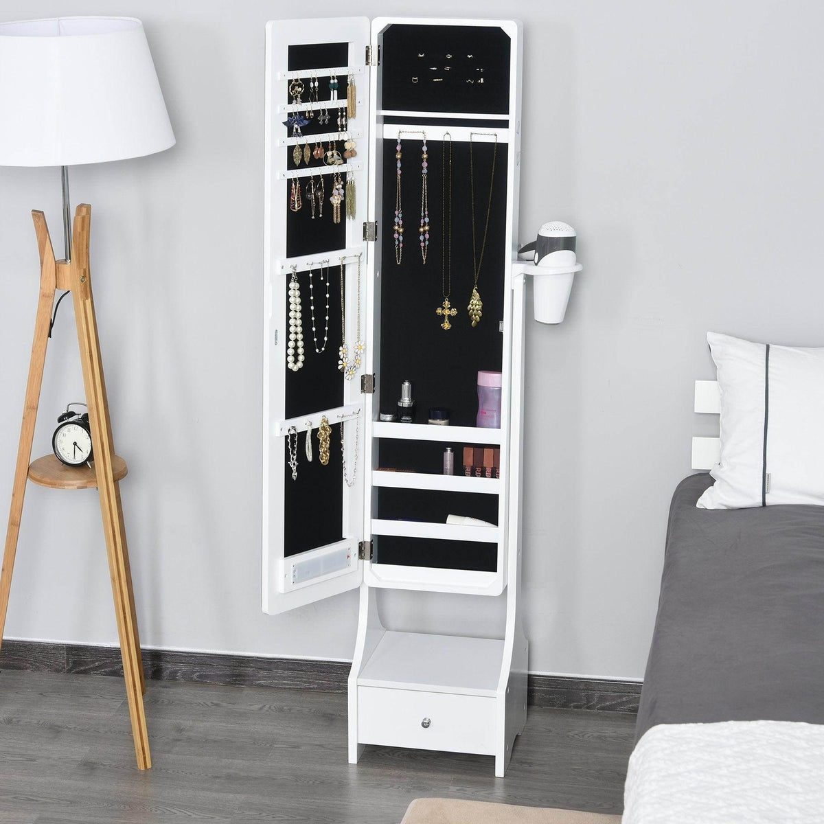 White mirror jewelry armoire with open storage compartments and hanging hooks
