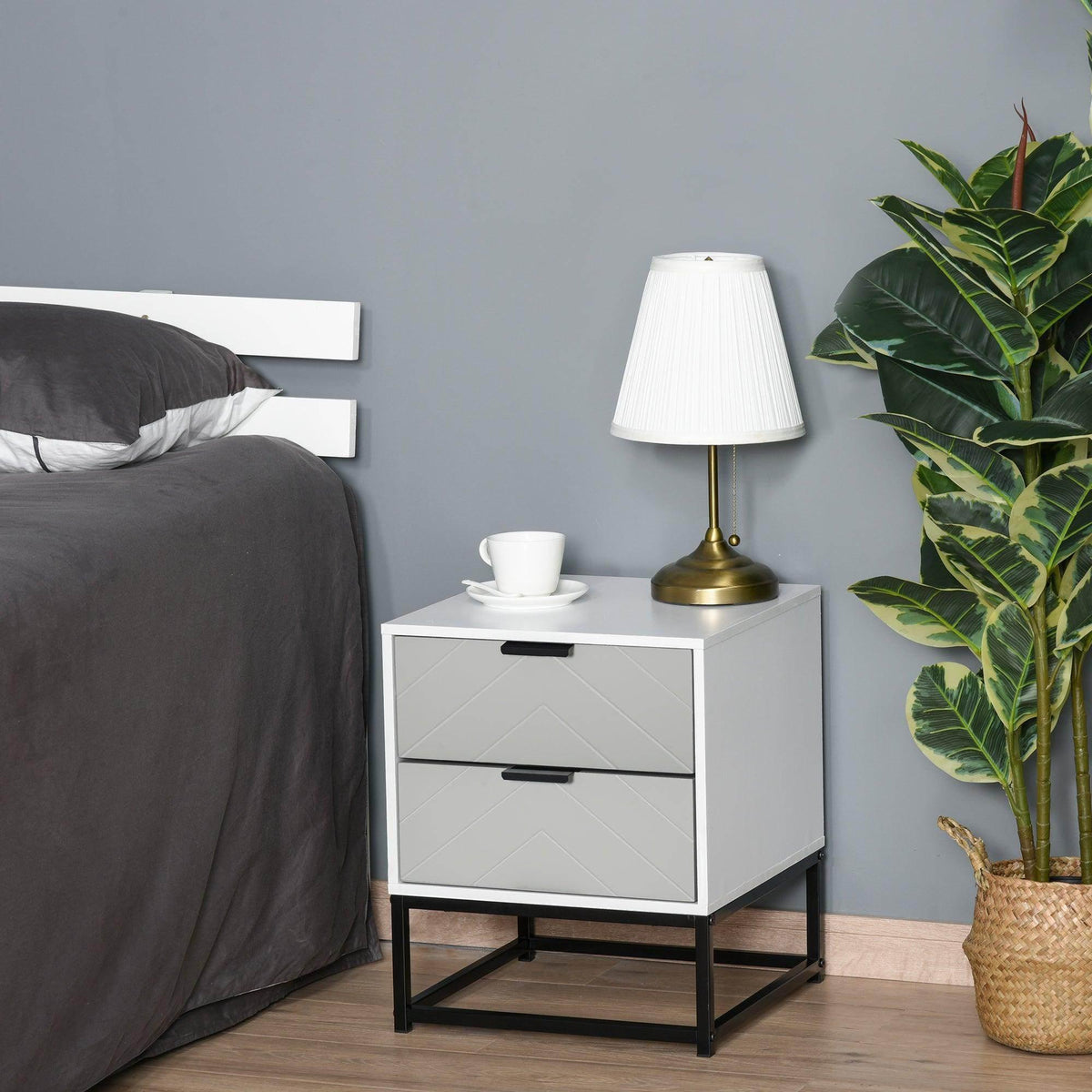 White bedside cabinet with 2 drawers and black metal base, styled with a lamp on top