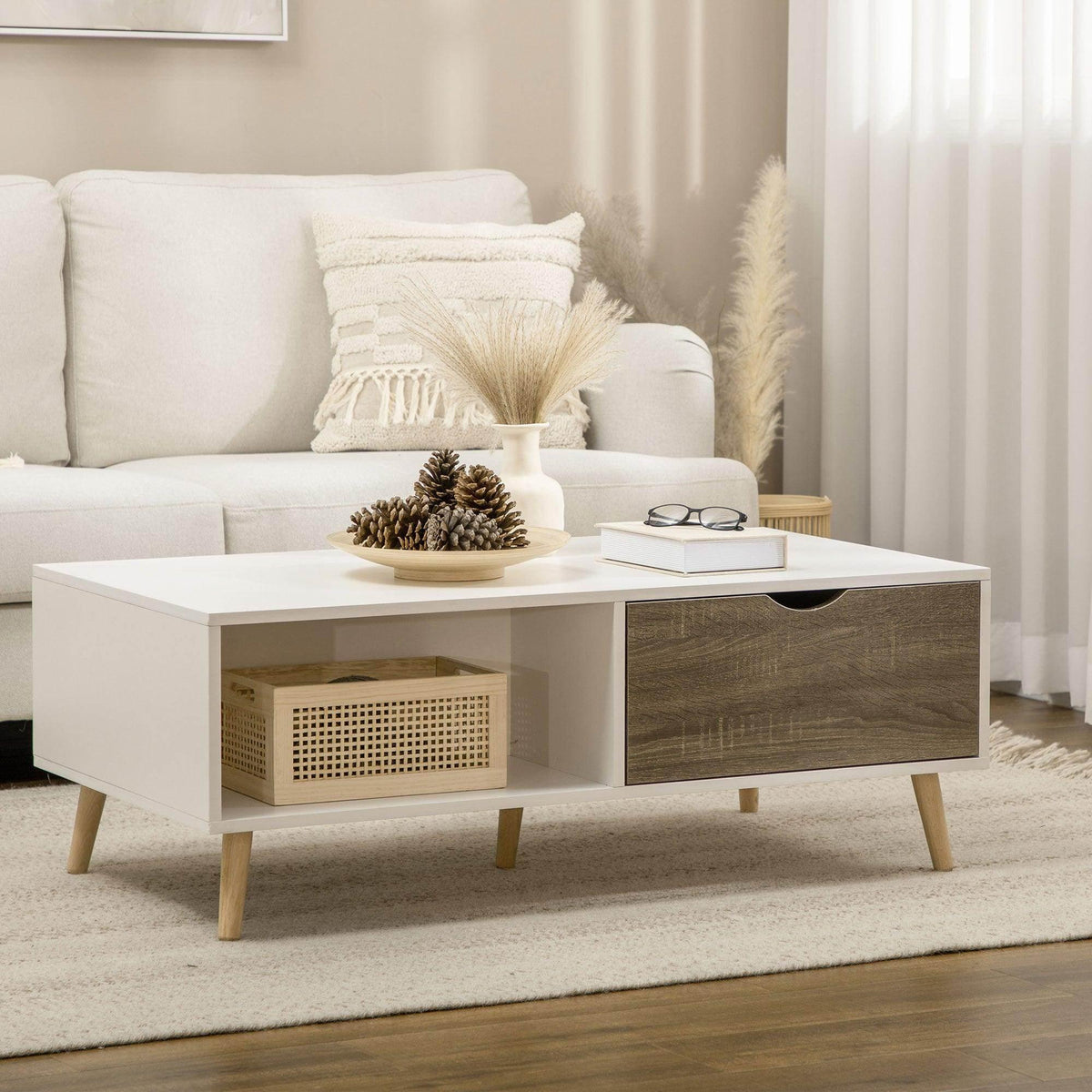 White coffee table with open shelf, lattice storage insert, and dark wood-grain drawer