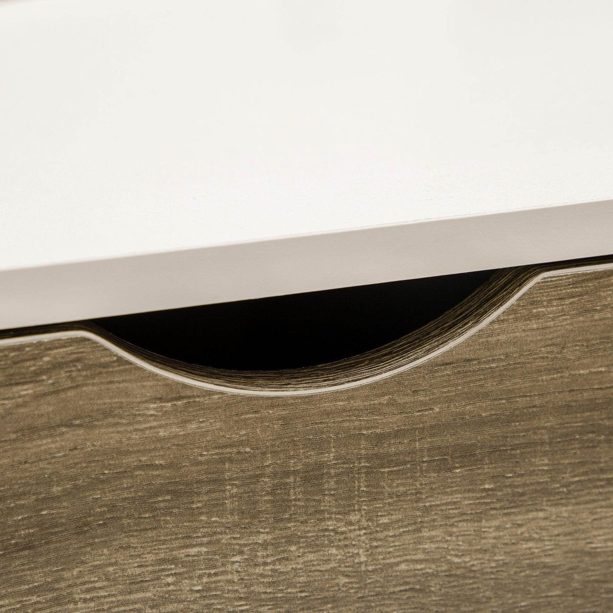 Close-up of coffee table underside showing curved cutout under the tabletop