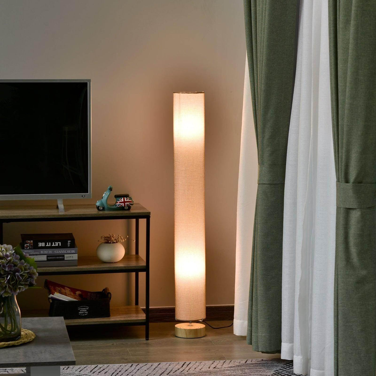 Modern wooden floor lamp with beige linen drum shade, warm glowing light