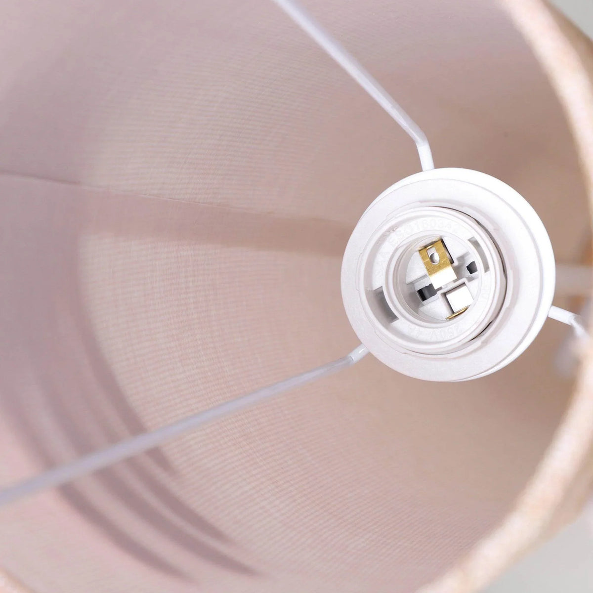 Close-up of lamp socket inside the linen drum shade with wiring connection