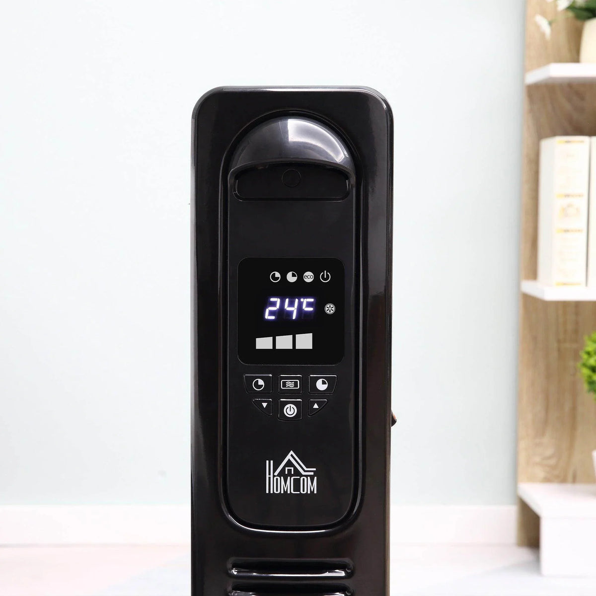 Black oil-filled radiator heater front control panel with 24°C temperature display