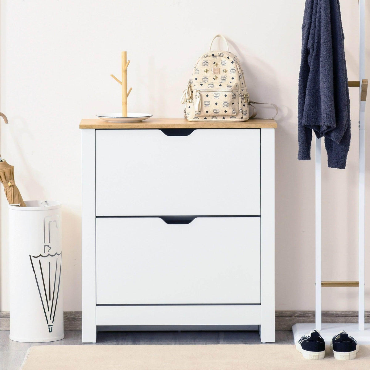 White shoe cabinet with light wood top and two drawer fronts, modern design.
