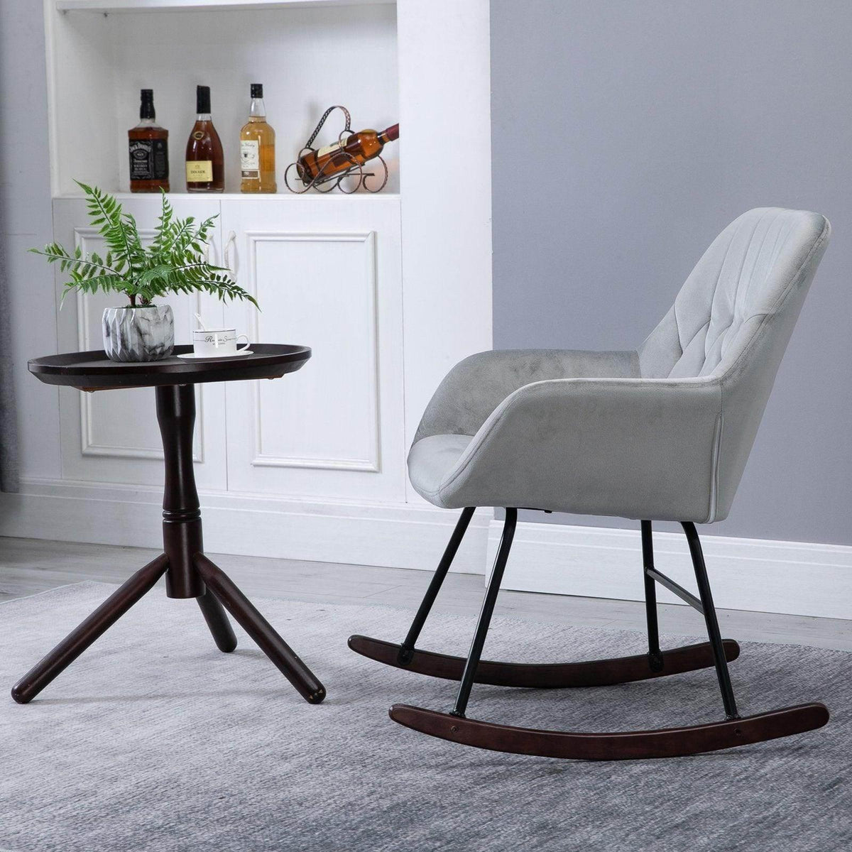 Light grey rocking chair with tufted back and armrests, black frame, curved brown rockers
