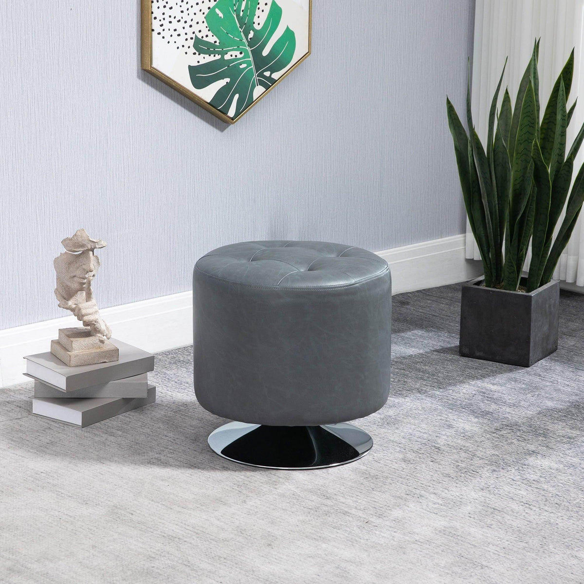Gray round swivel footstool with plush padded top and black steel base