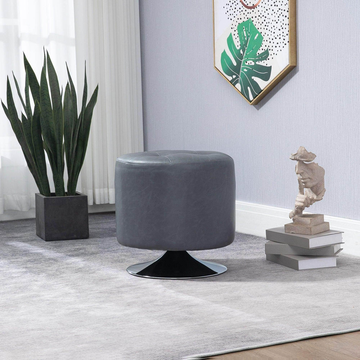 Gray round swivel footstool with padded seat and black rotating base