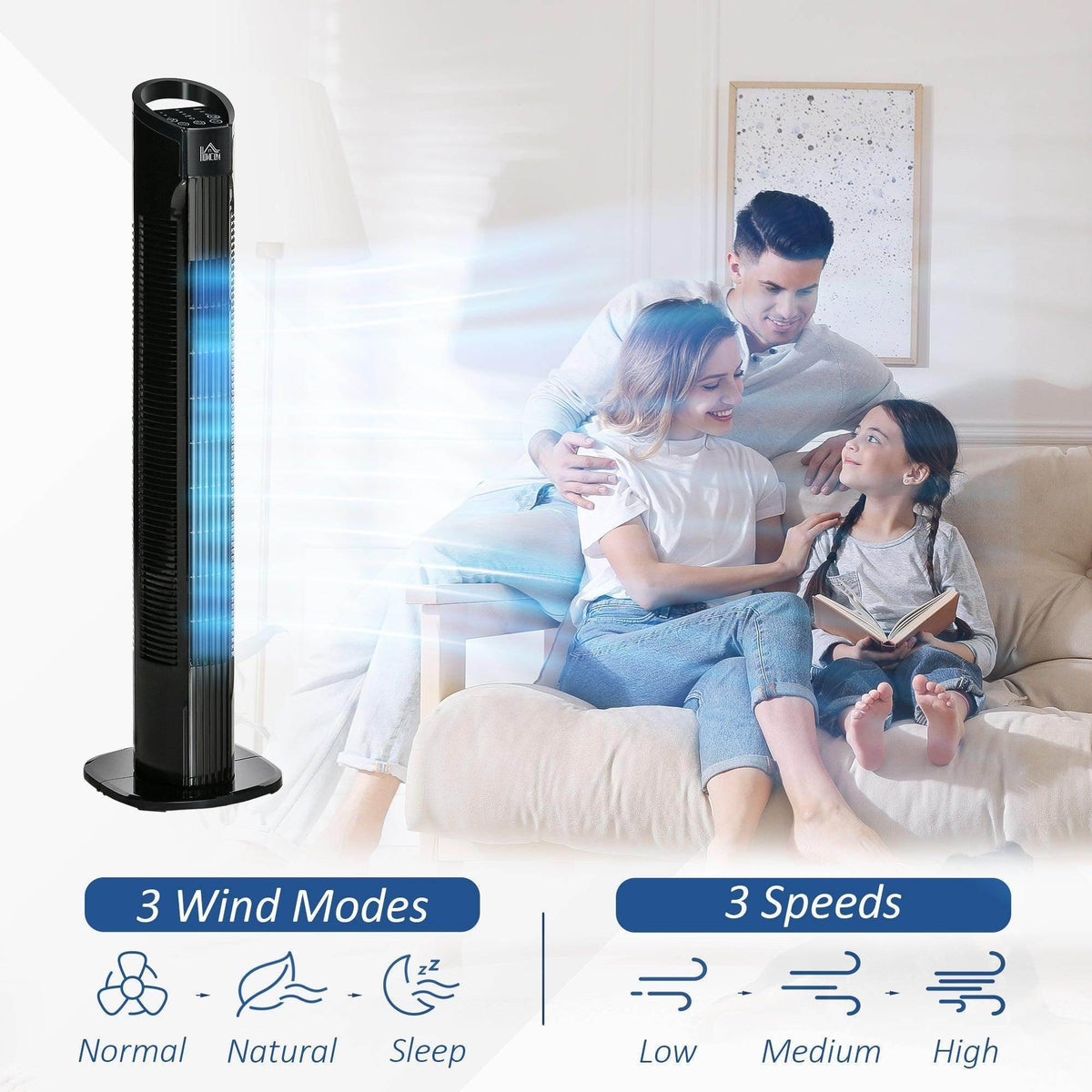 Black tower fan with visible airflow, placed beside a couch in a living room.