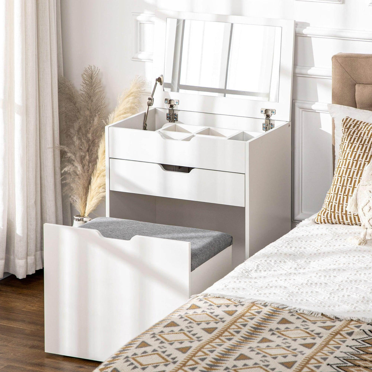 White vanity table with flip-up mirror and open hidden storage drawer