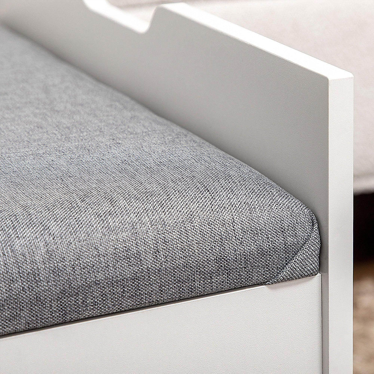 Gray cushioned top on a white vanity stool with clean, squared edges