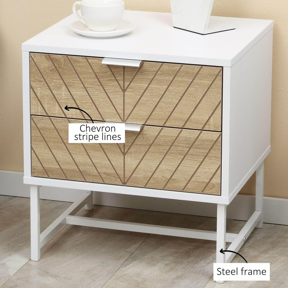 White bedside table with two drawers featuring chevron stripe lines, metal frame