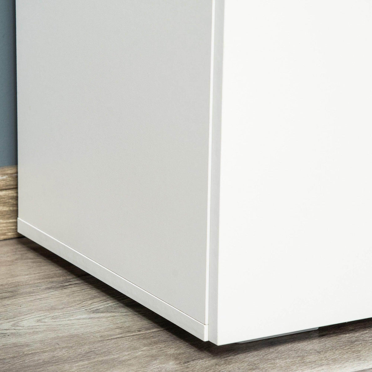 White freestanding cabinet side panel with flat door surface and squared base