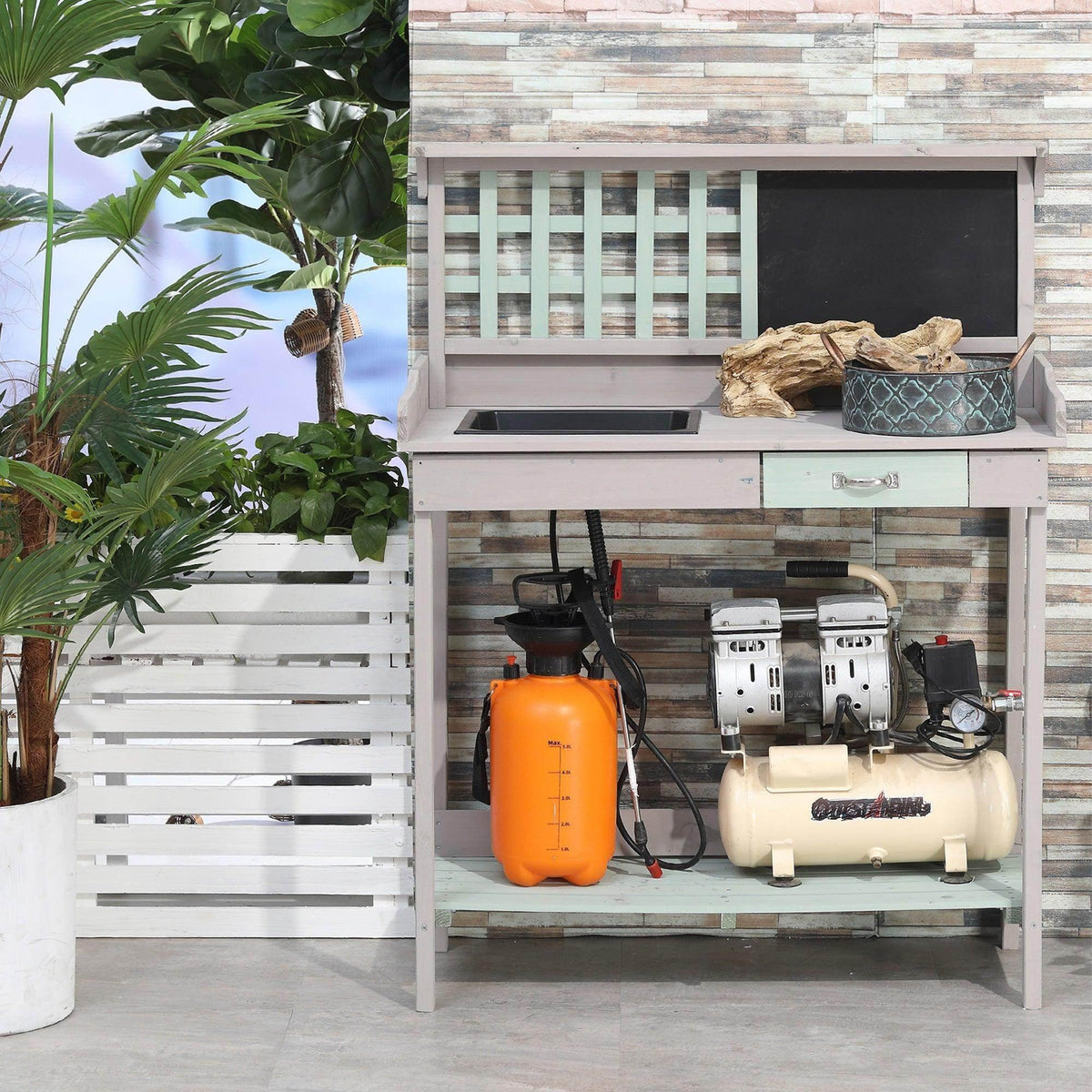 White outdoor potting table with open shelf and drawer storage
