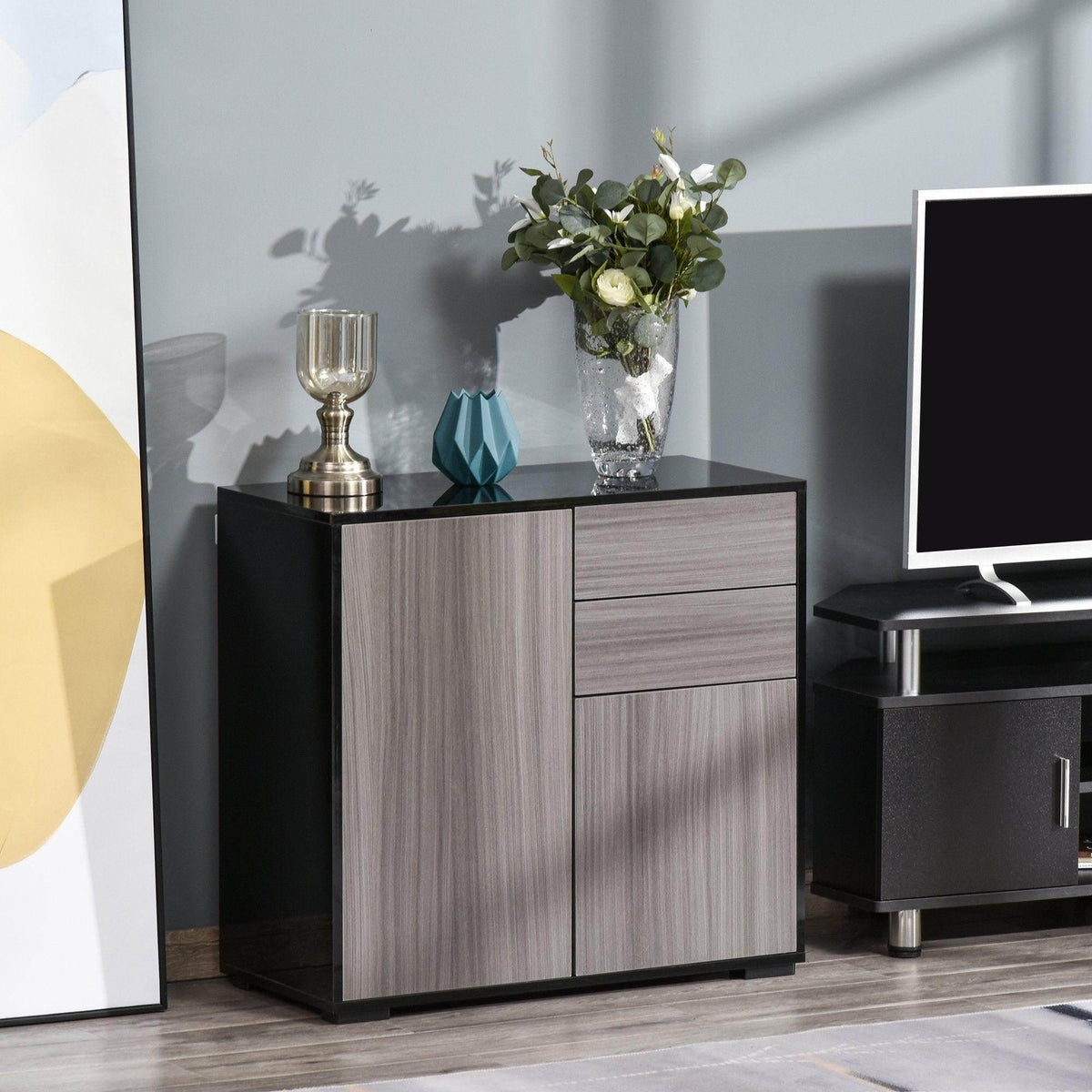 Light grey and black modern cabinet with 2 doors and 2 drawers, flat top.