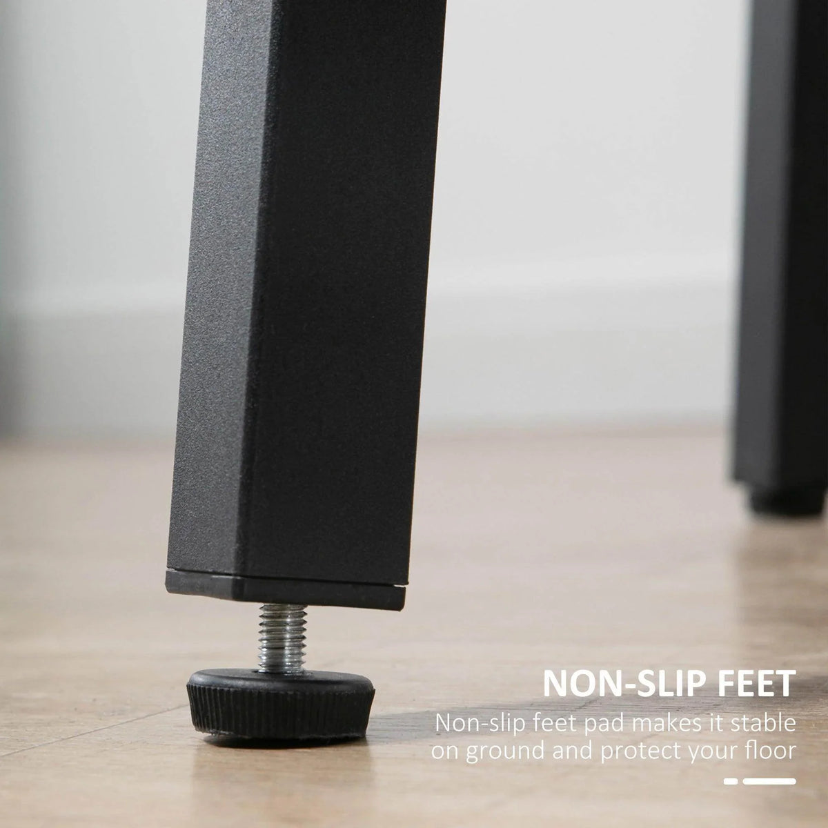 Black steel table leg with non-slip rubber foot for stable floor contact.
