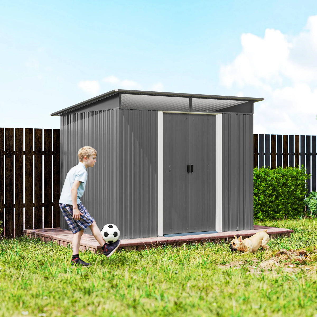 Light grey metal garden storage shed with double doors closed in a backyard