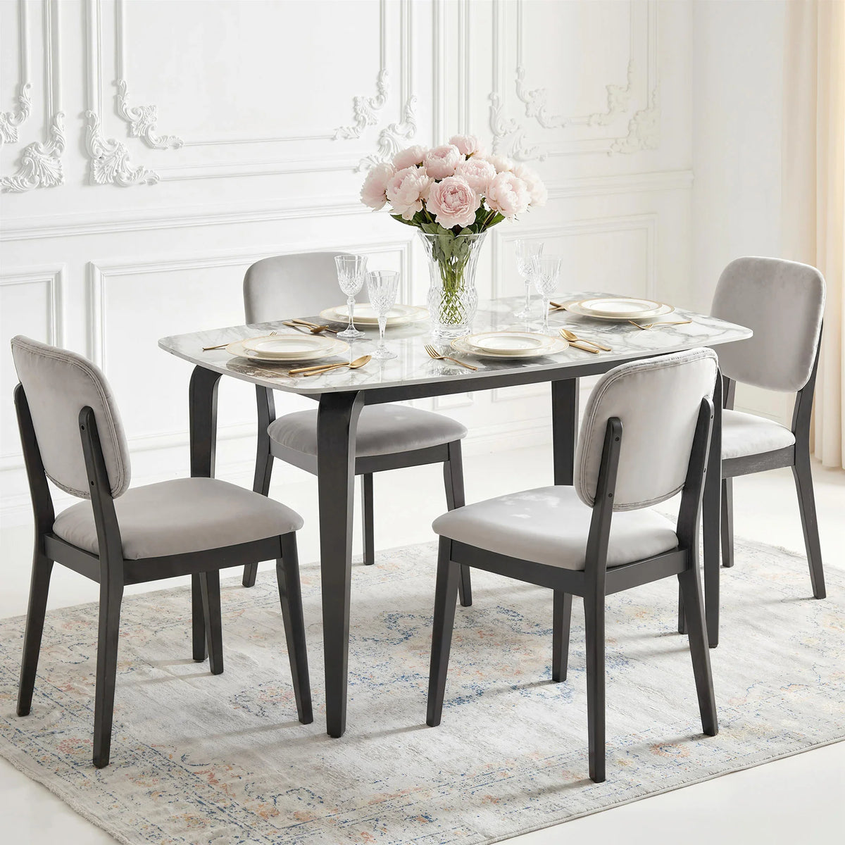 Dining set with marble-vein sintered stone table top, dark metal legs, and 4 light chairs