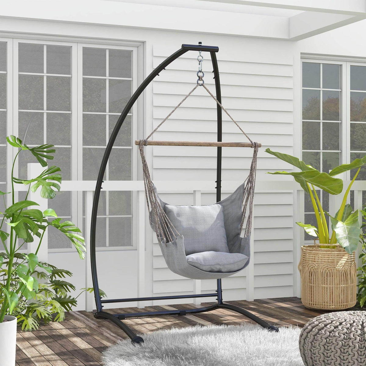 Black C-shaped hammock chair stand with arched frame and hanging chains