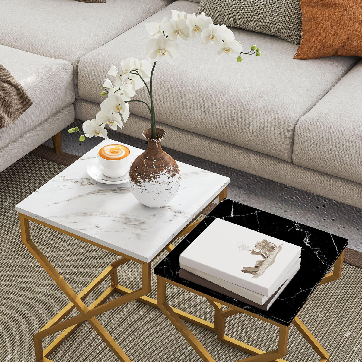 Marble-effect nesting table set with white top and black top insert, gold frame base
