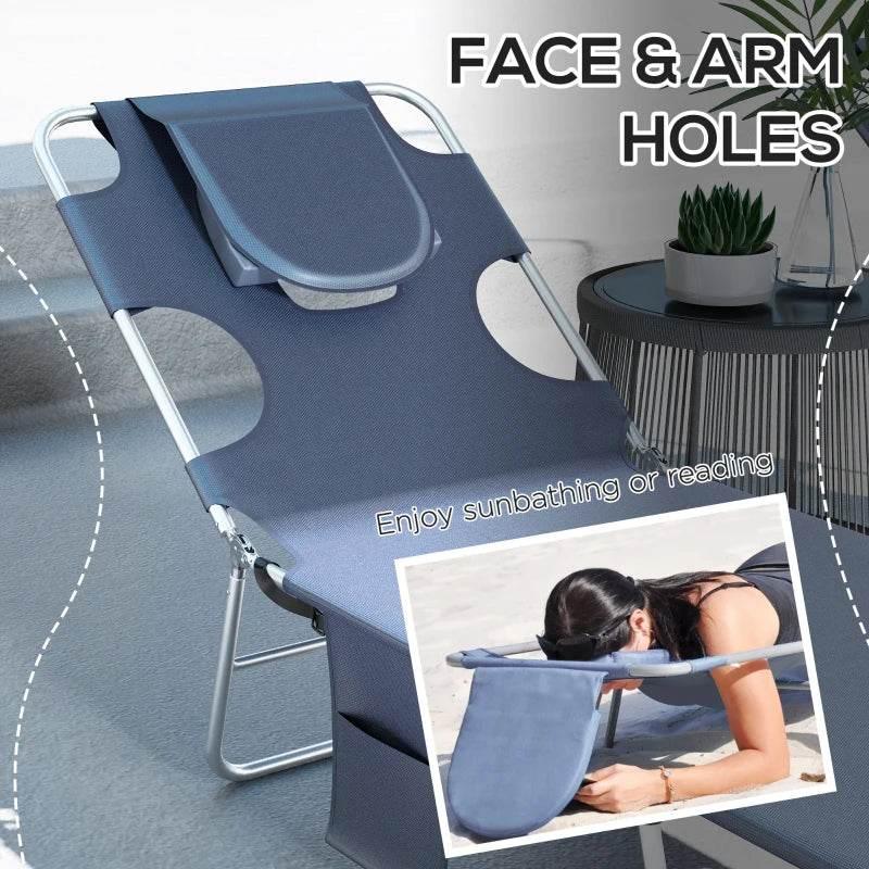 Blue sun lounger with face-and-arm holes and attached headrest pillow