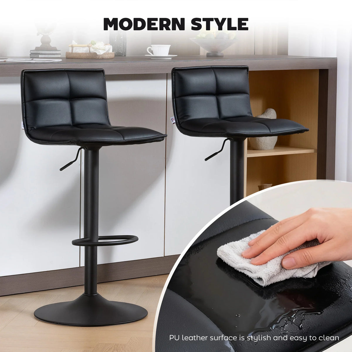 Set of two black faux-leather bar stools with padded backrests; wipe-clean seat