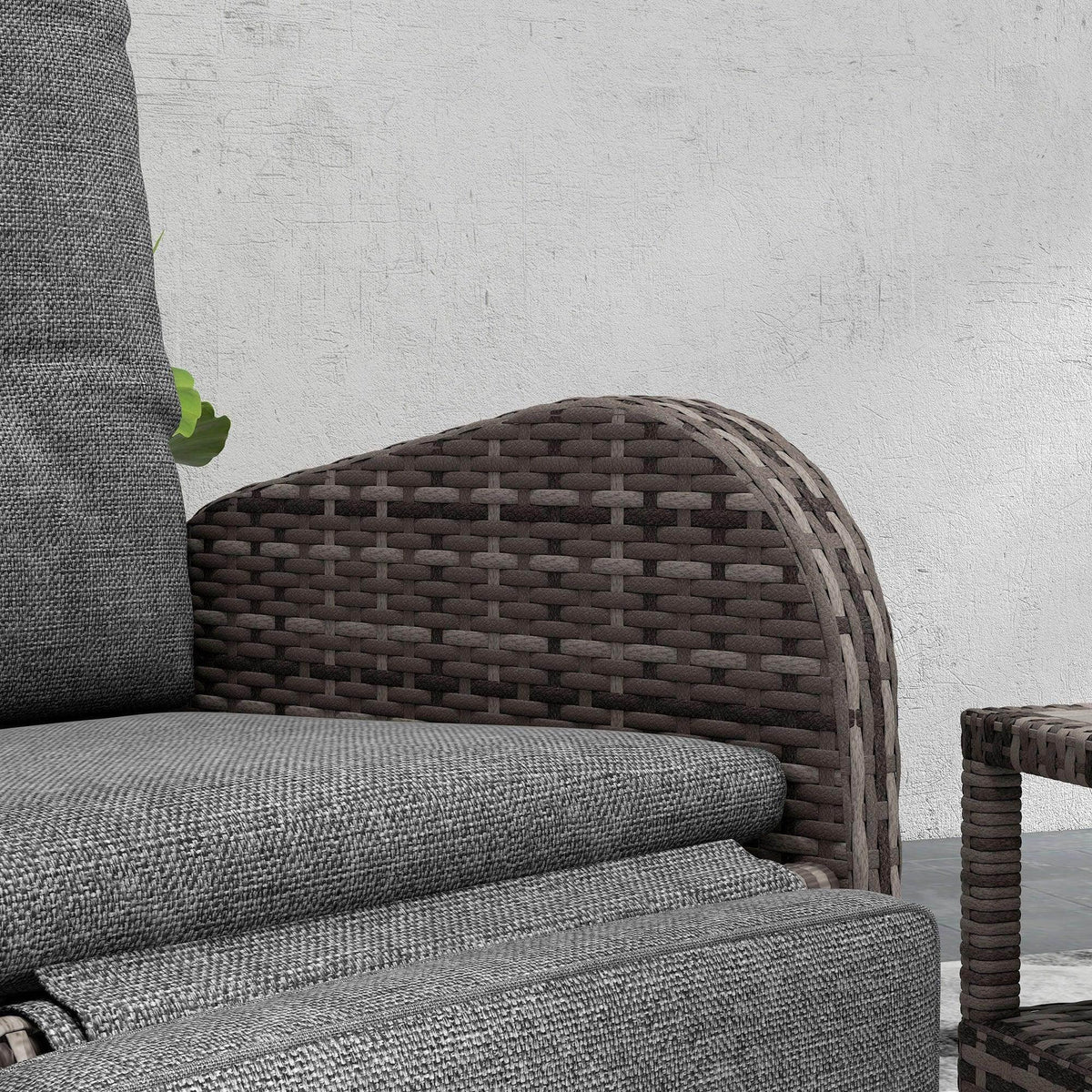 Patio chaise lounge chair with brown woven rattan frame and gray seat cushions