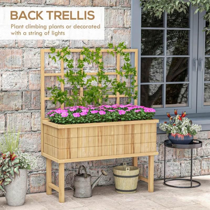 Wooden garden planter with trellis backing and purple flowers in raised box