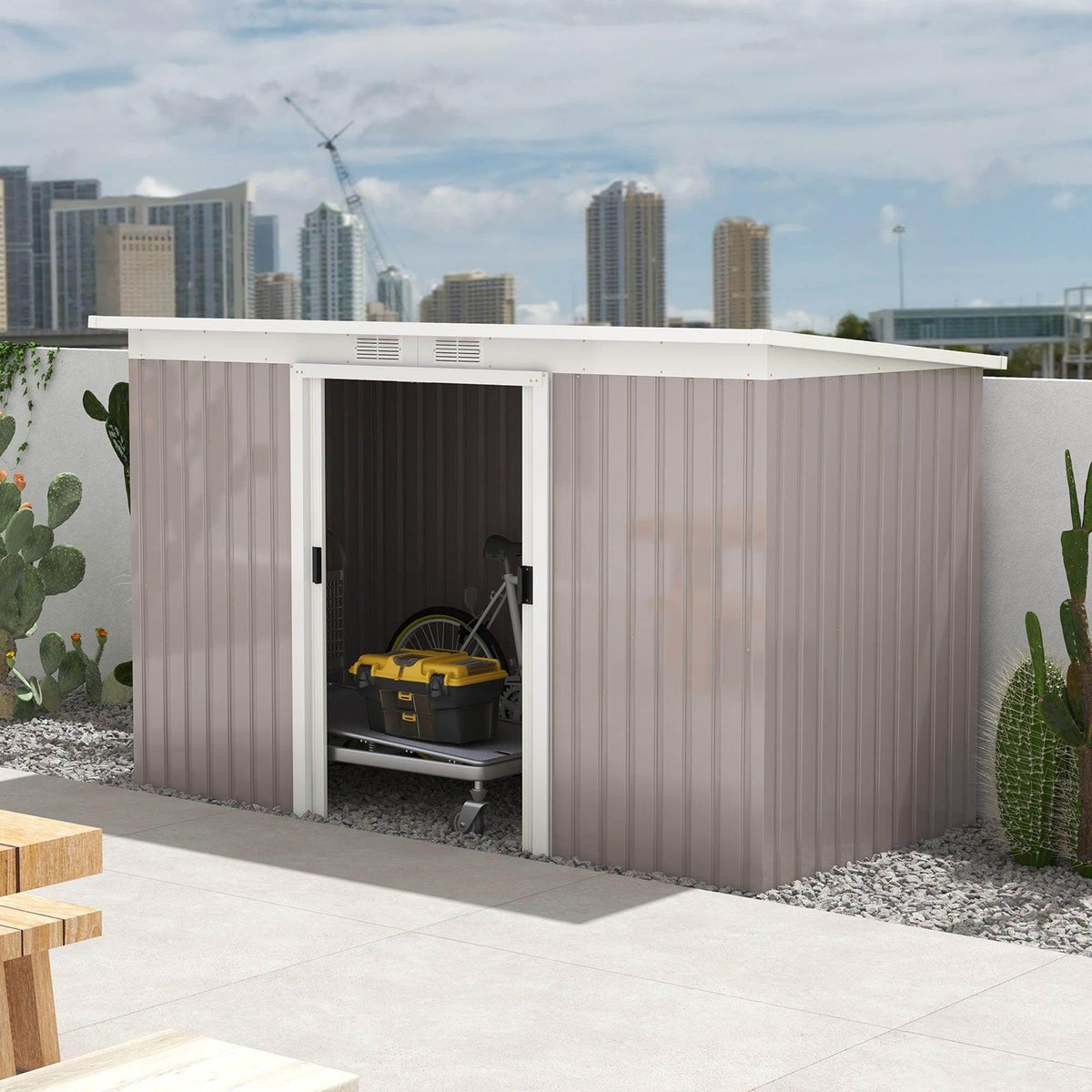 Light grey metal garden storage shed with two open sliding doors, interior visible
