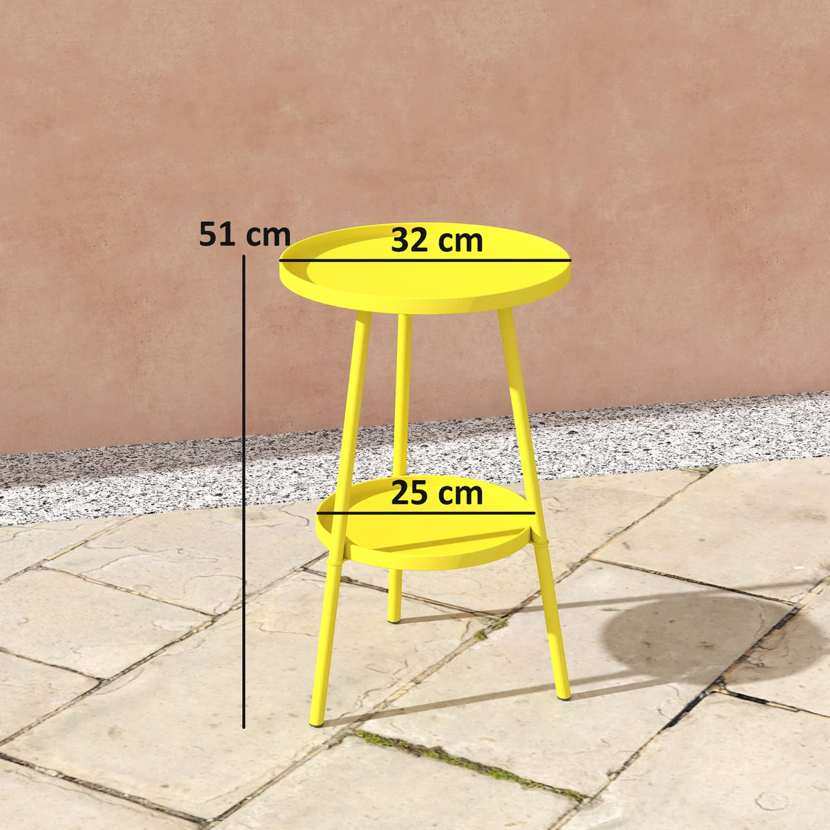 Yellow two-tier round metal table with top and lower shelf, shown on patio pavers