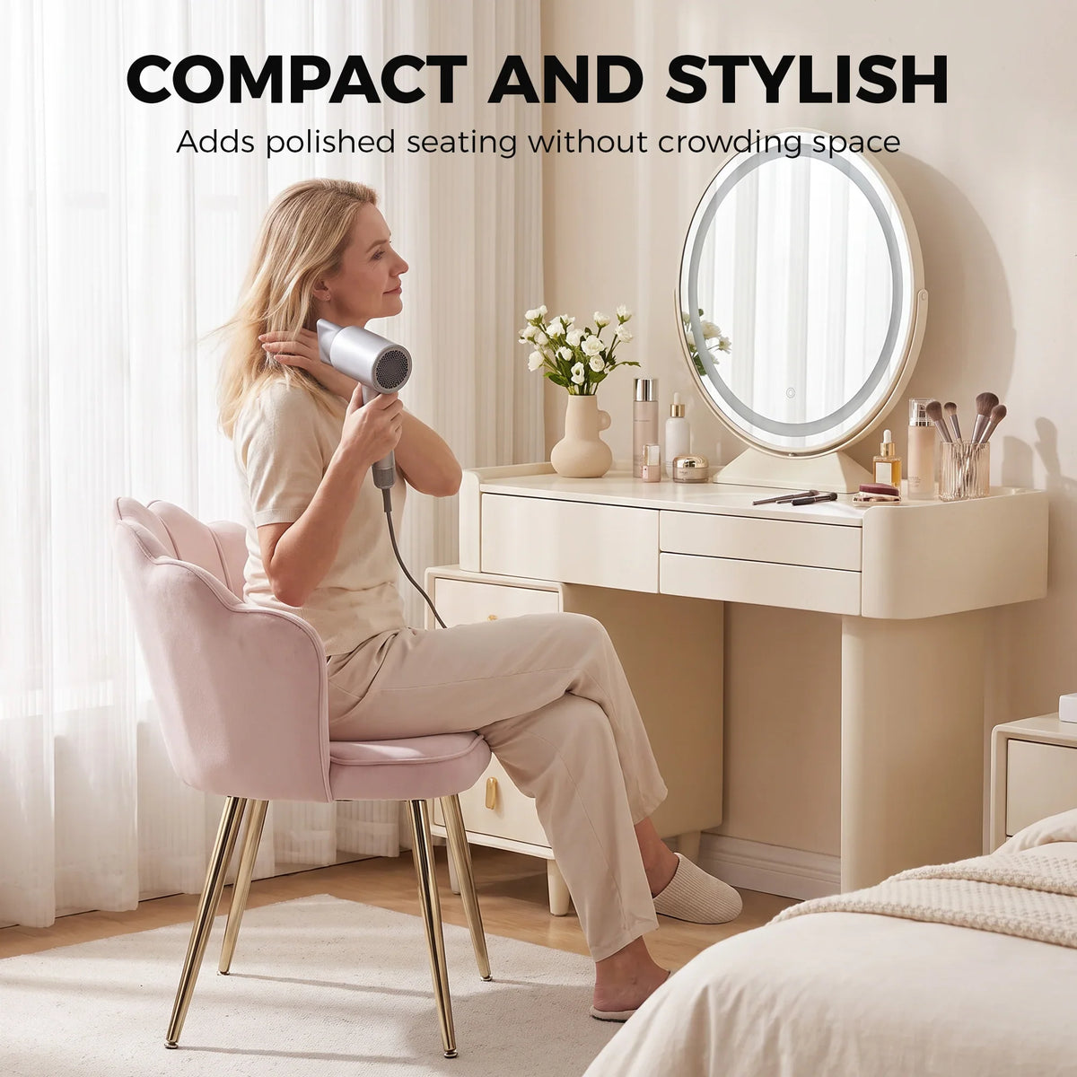 Soft pink velvet accent chair with heart pillow and gold-tone legs