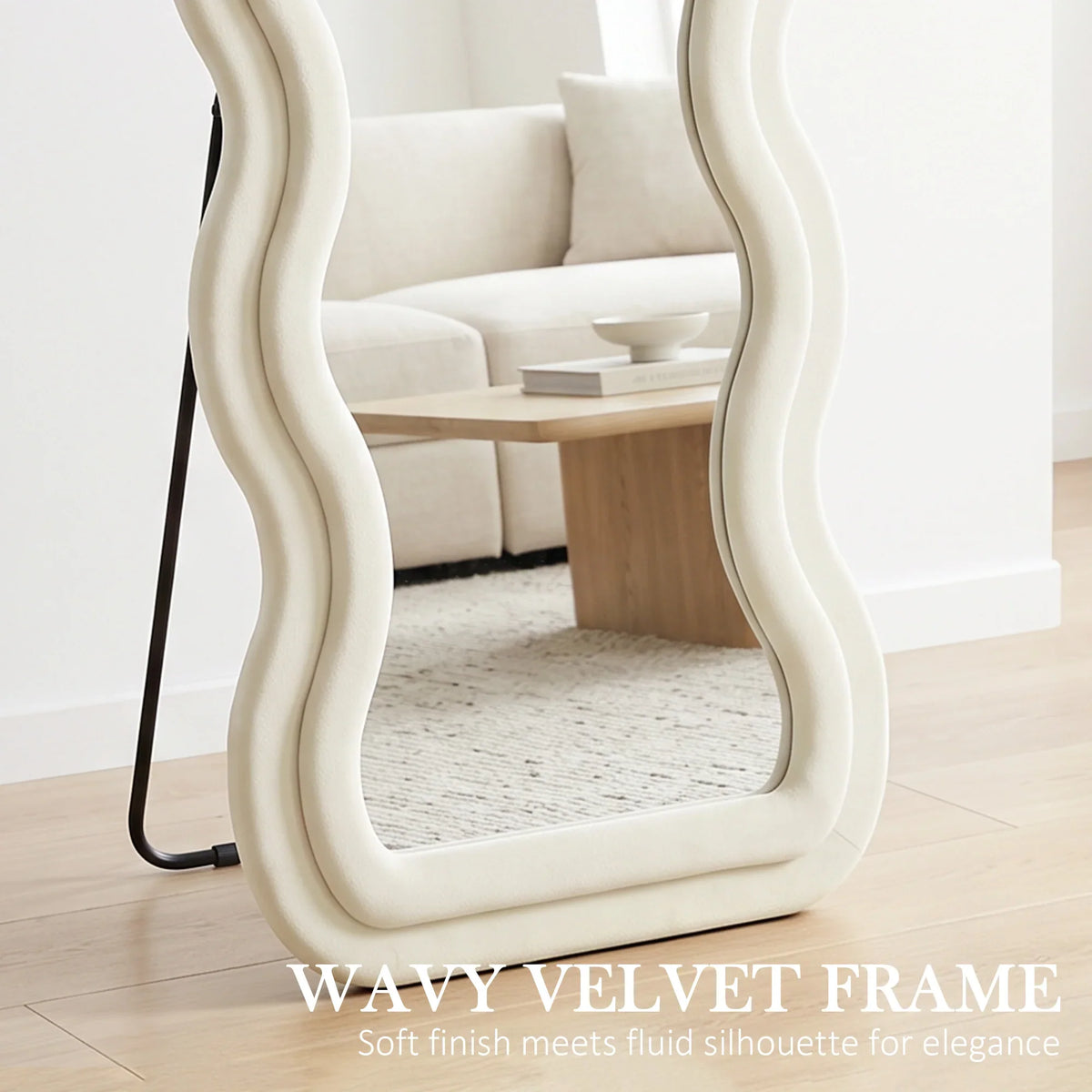 Full-length mirror close-up showing cream wavy velvet frame and clear glass