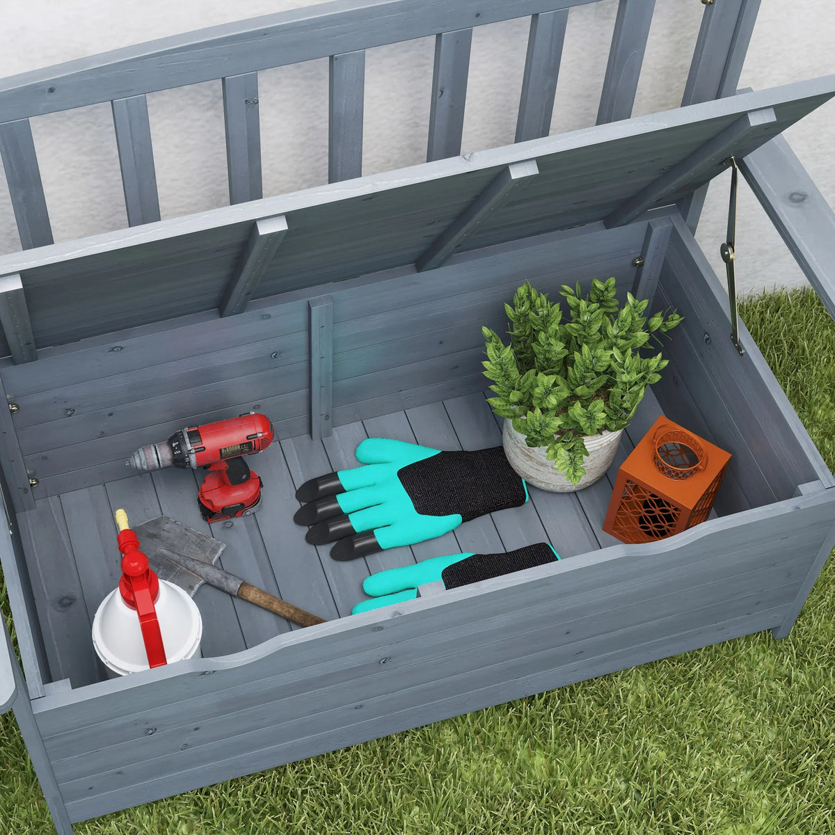 Two-seat storage bench open inside shows gardening tools, gloves, and plant pot