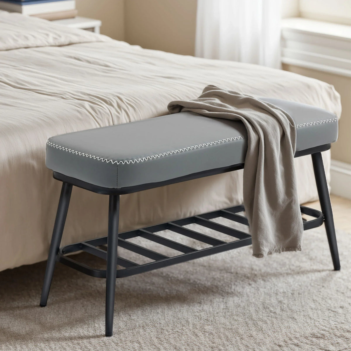 Grey PU leather shoe storage bench with cushioned seat and open slat shelf