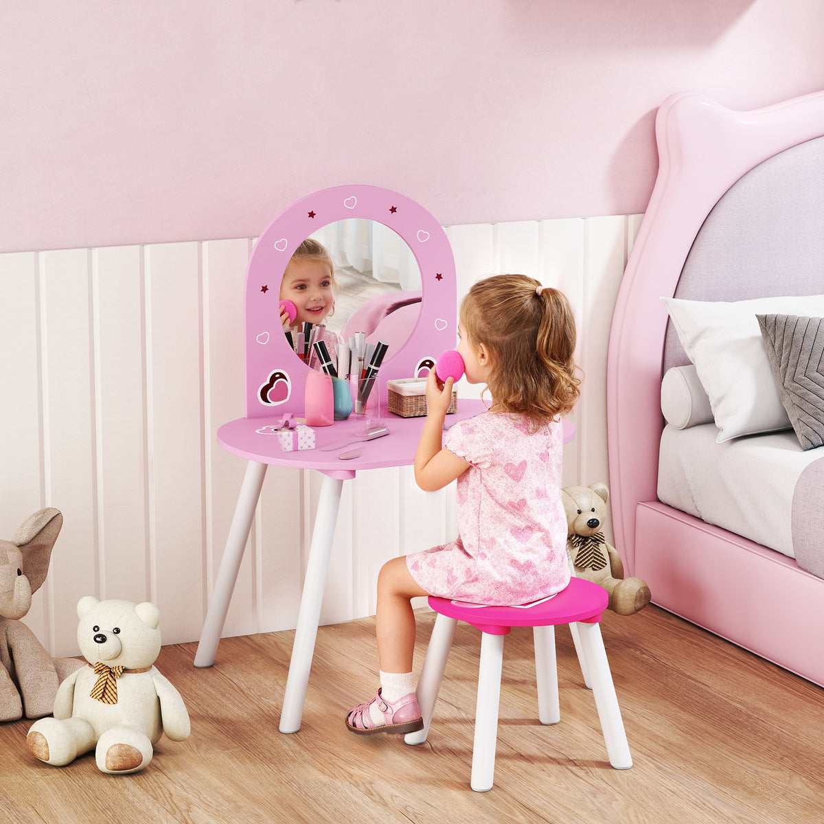 Kids pink dressing table with round mirror and matching stool, with toy makeup items