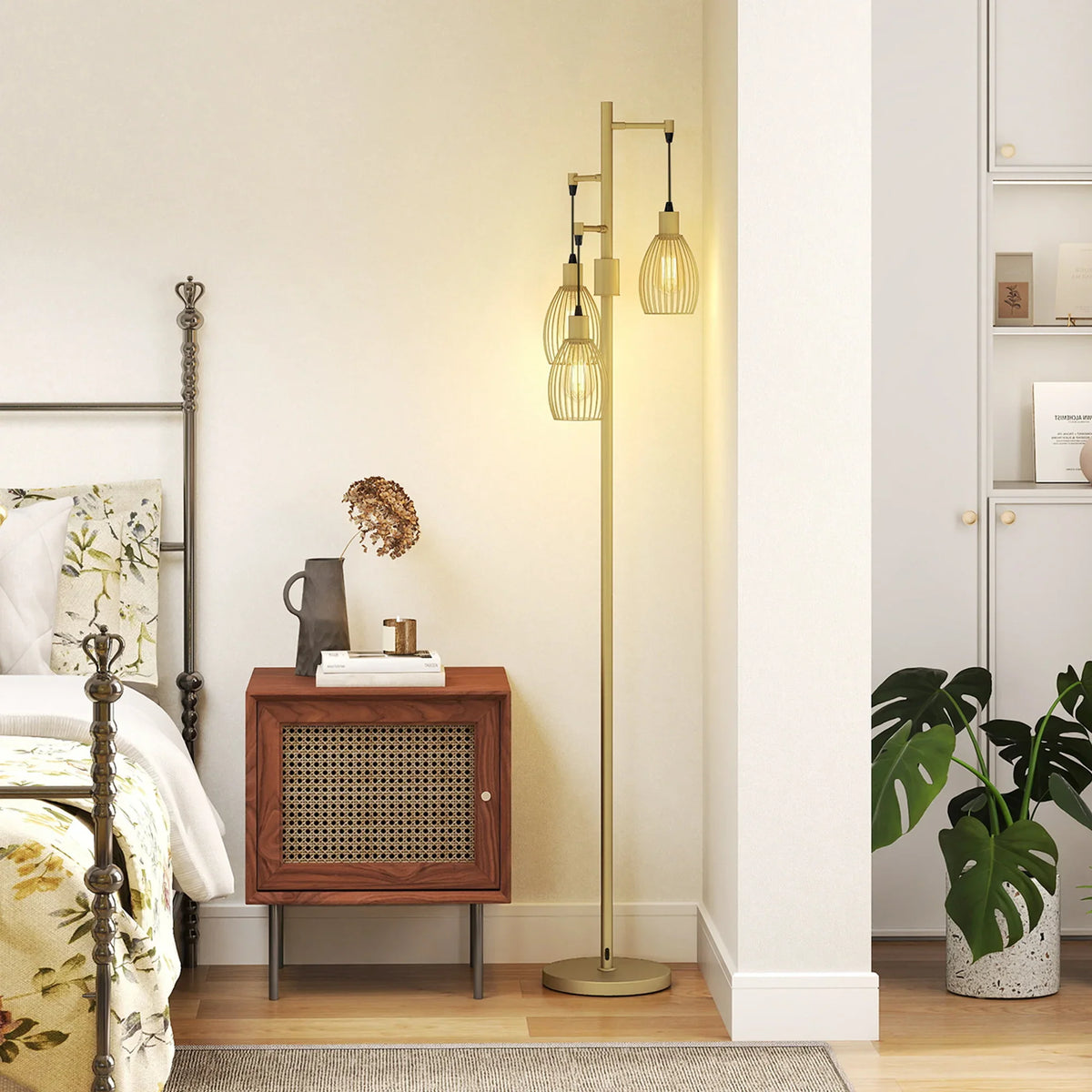 Gold-tone indoor floor lamp with three wire cage shades and exposed filament bulbs on round base