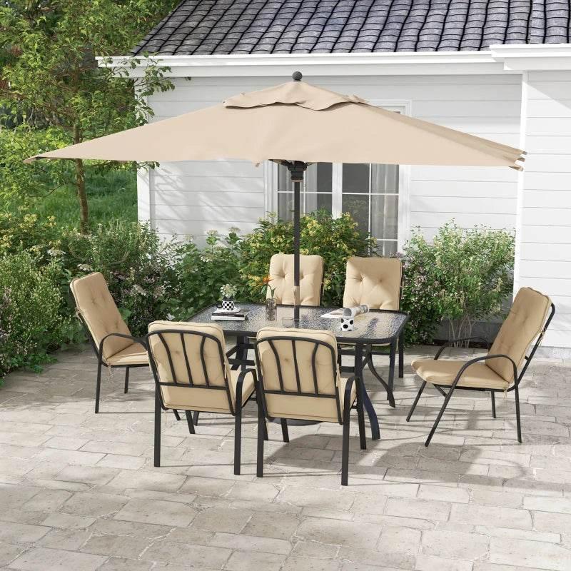 Outdoor dining set with beige umbrella, six beige cushioned armchairs, black glass table