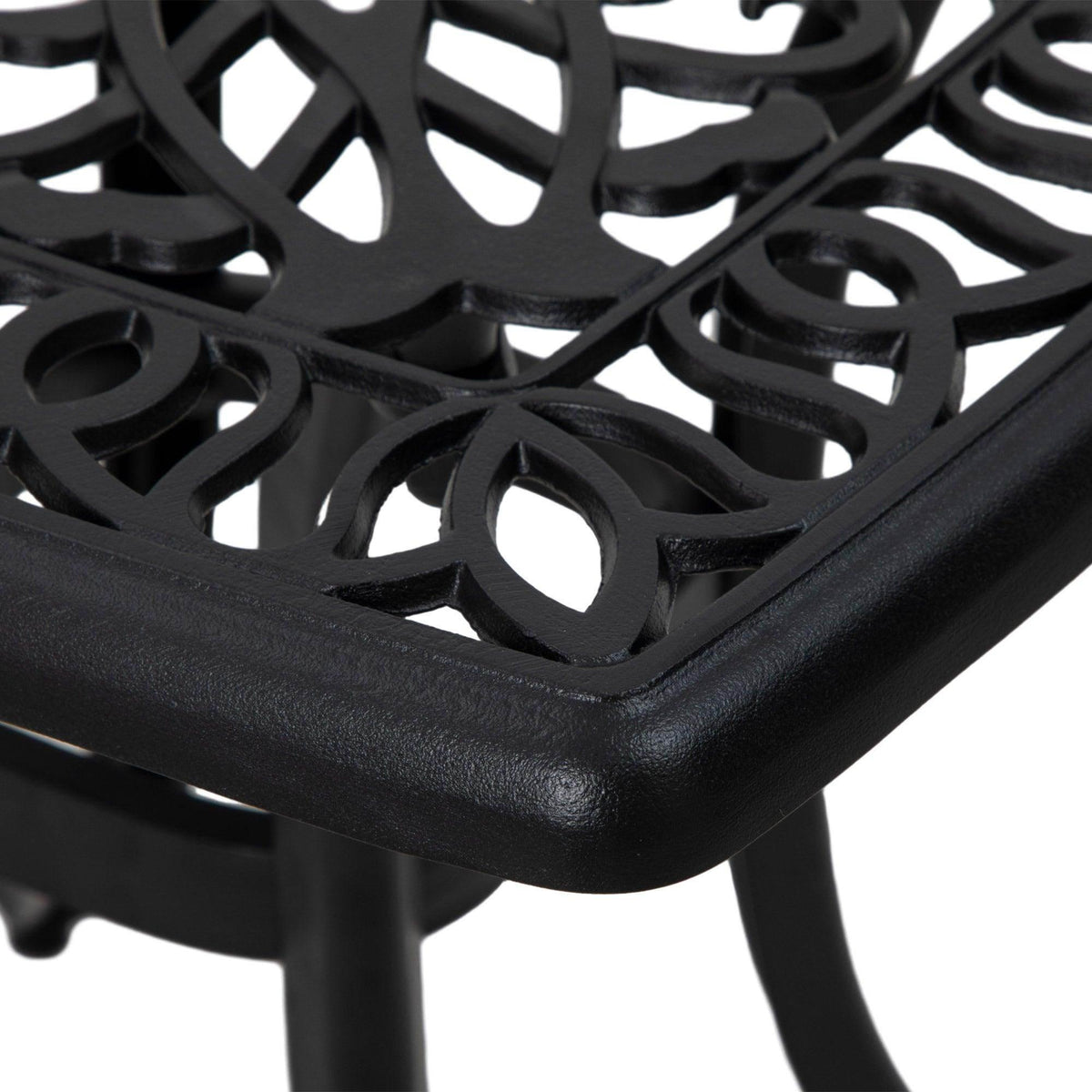 Black cast aluminum table corner with raised edge and decorative lattice top pattern