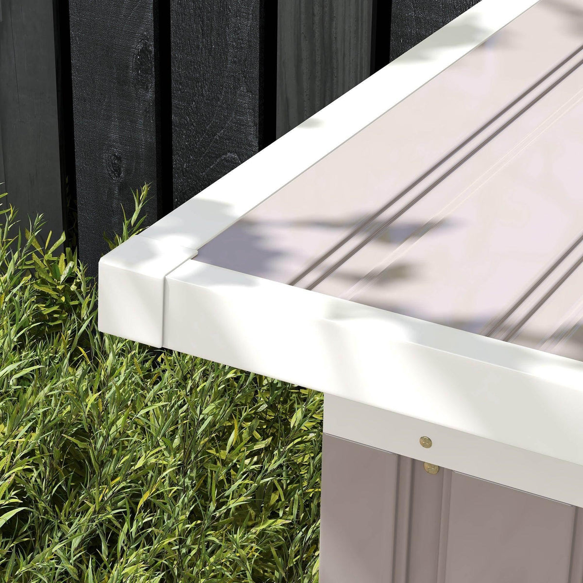 Light grey metal shed base with side panels and ground clearance on grass