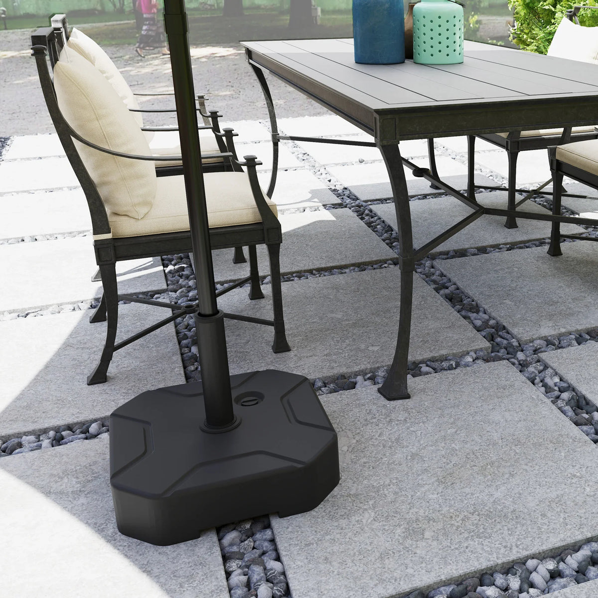 Black umbrella base stand with sturdy corner plates and upright pole support