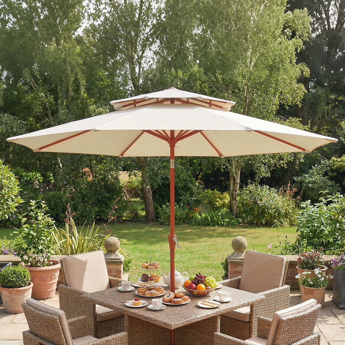 Cream double-top garden parasol shading outdoor dining set in a backyard garden