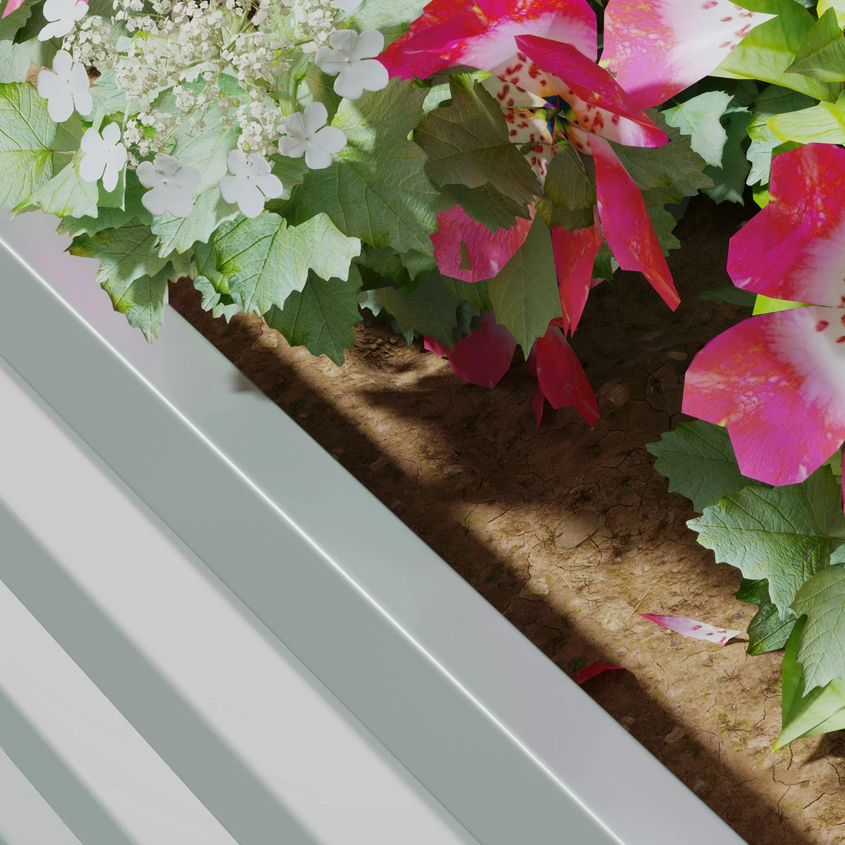 Gray raised planter box interior with soil and green leafy plants