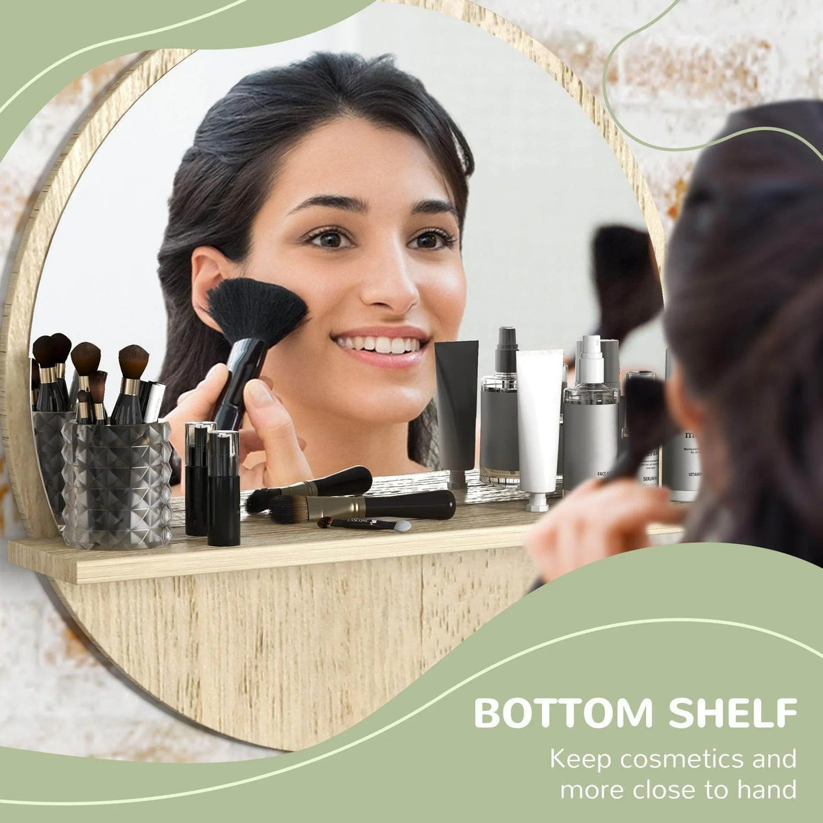 Round wooden bathroom mirror with bottom shelf holding cosmetics and brushes