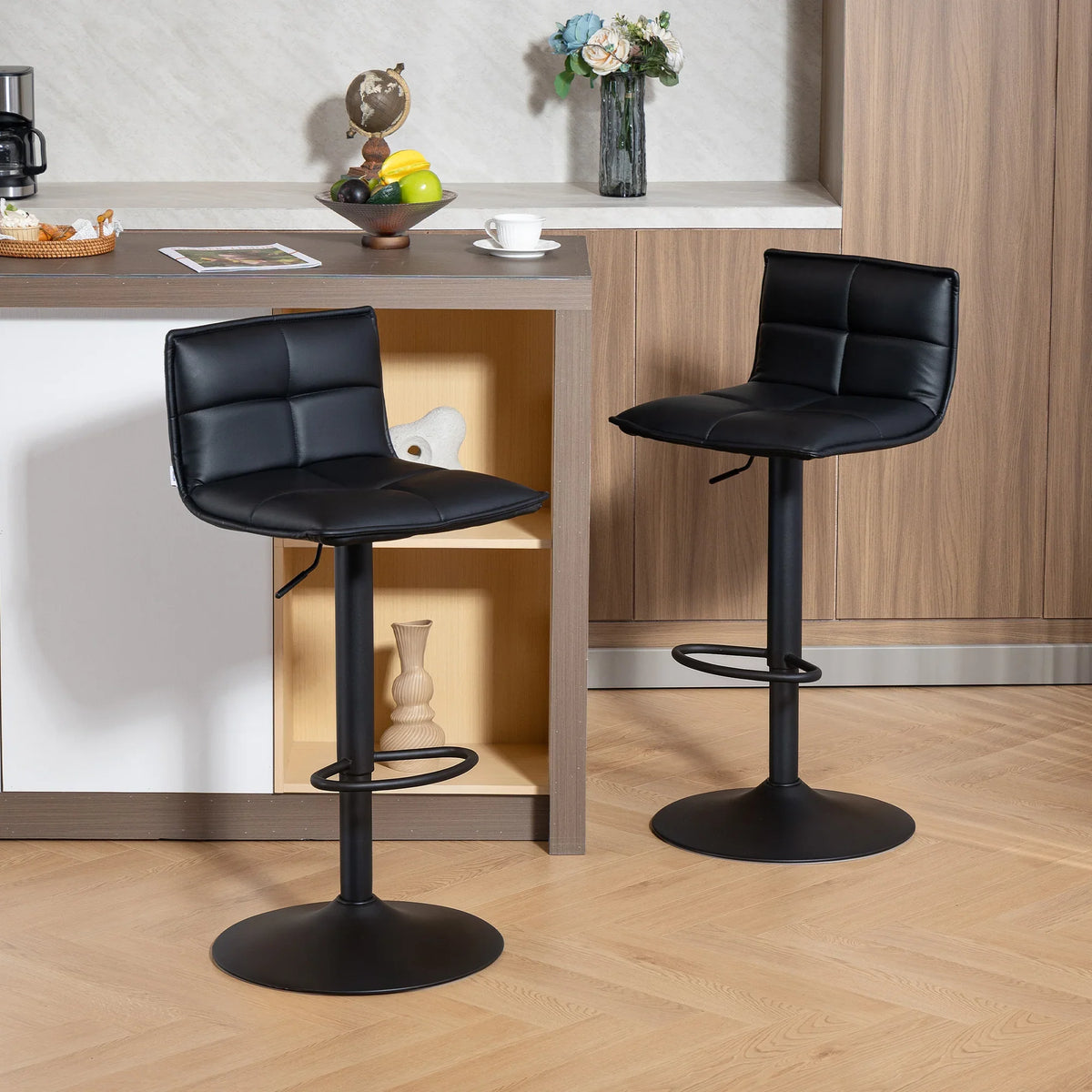 Set of two black faux-leather gas-lift bar stools with 360° swivel bases