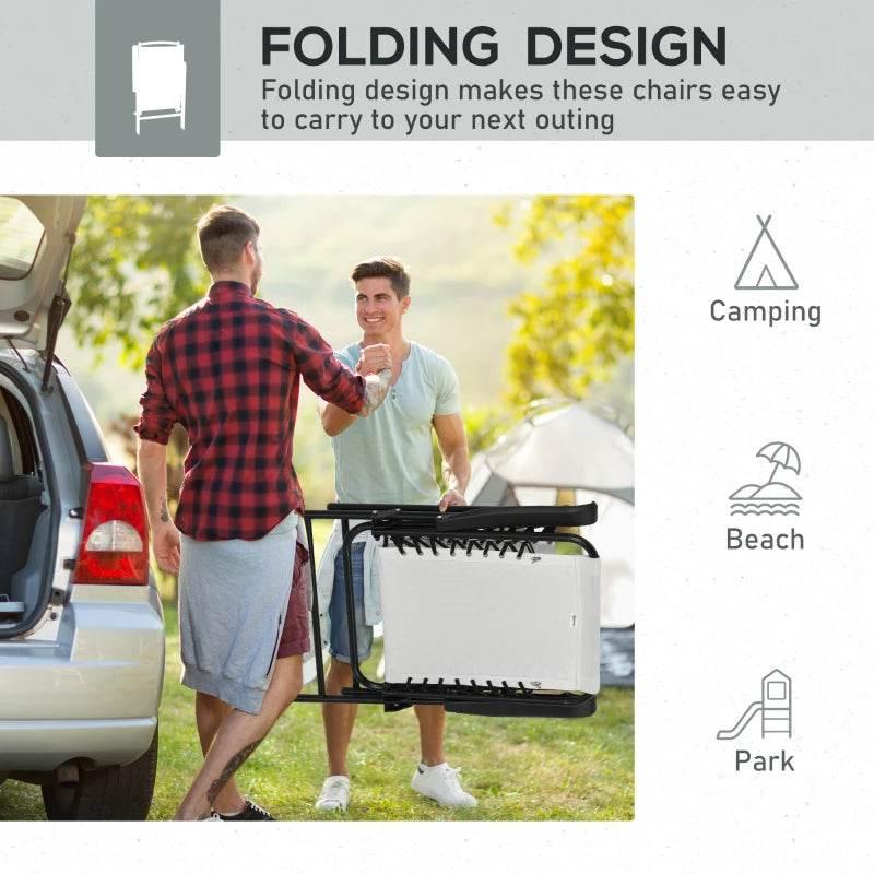 Cream white folding camping chair with black steel frame and armrests, being carried