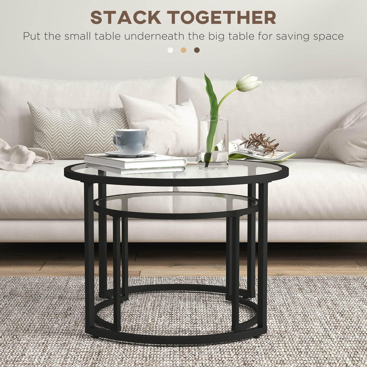 Round black glass coffee table with steel frame, stacked nesting design