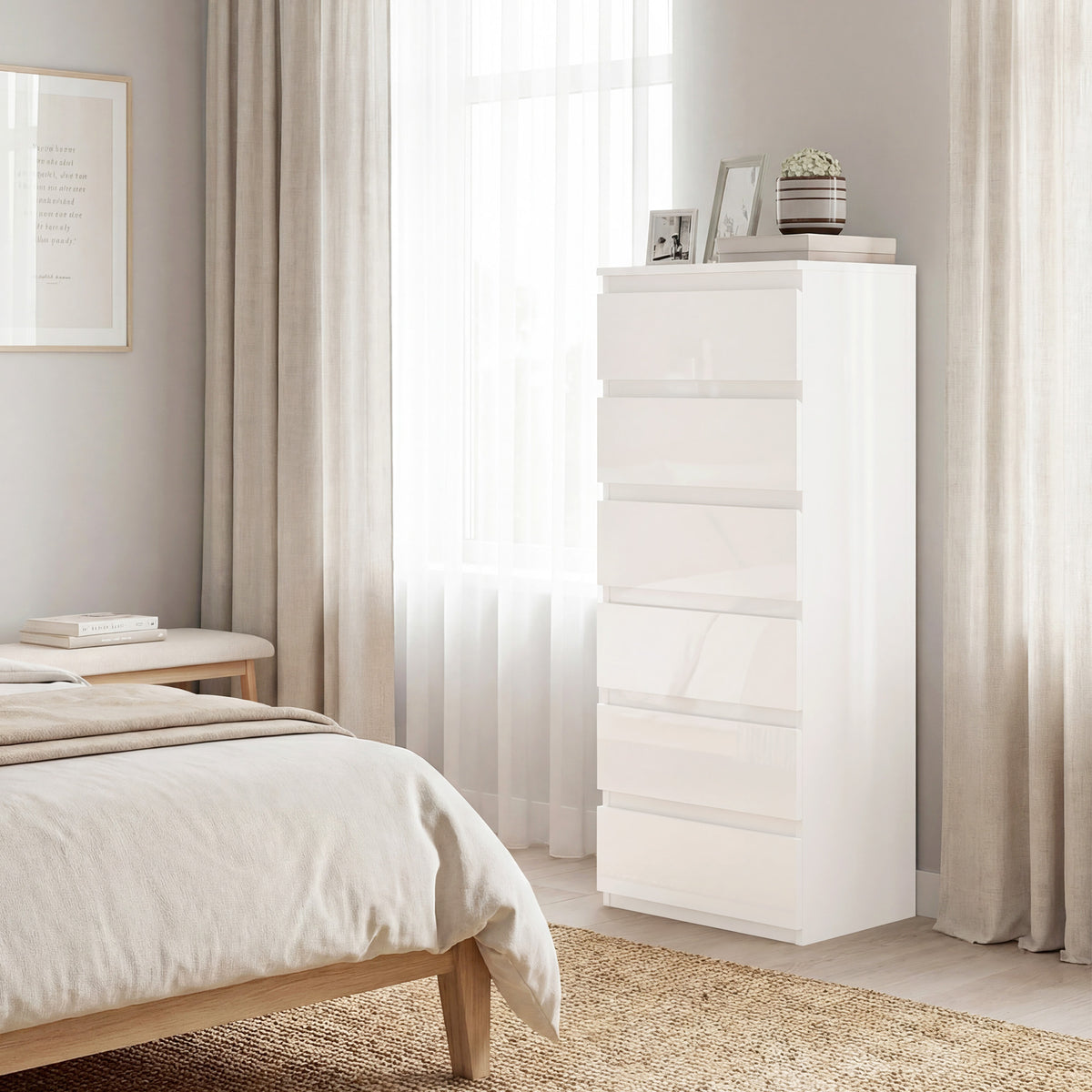 High-gloss white 6-drawer slim chest of drawers, angled view beside bed