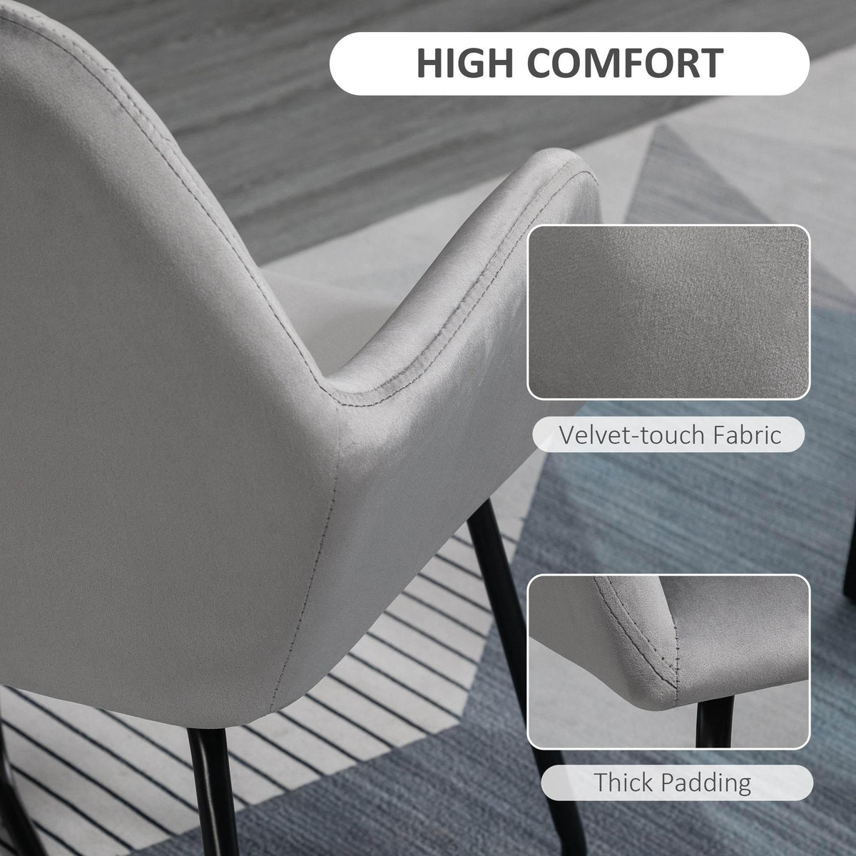 Grey velvet-touch upholstered armchair corner with thick padding and curved arm detail.