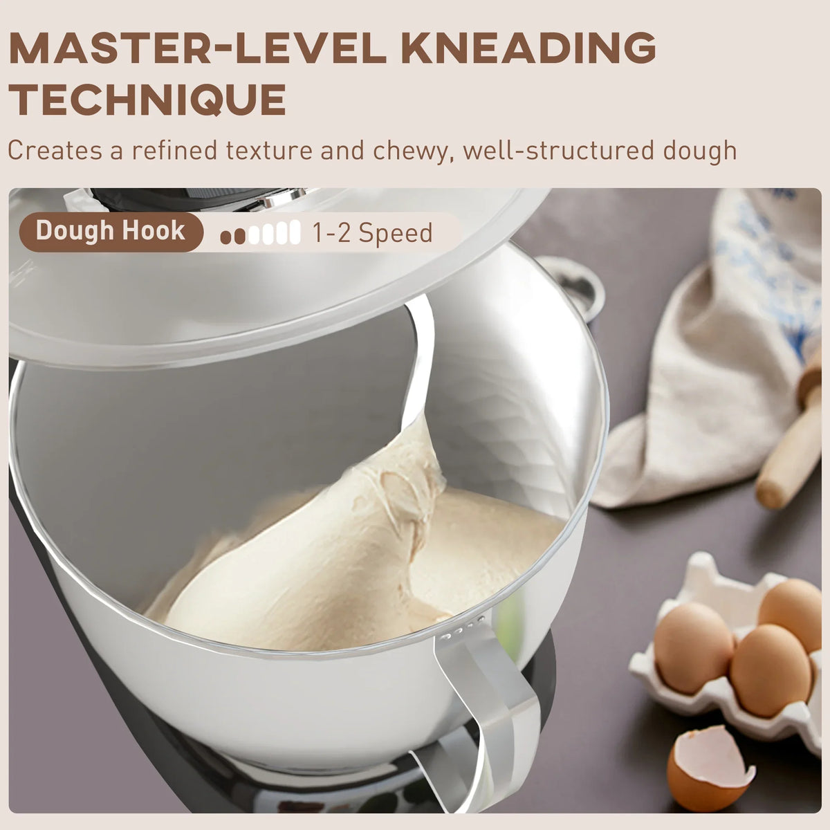 Black stand mixer with stainless steel bowl and dough hook for kneading
